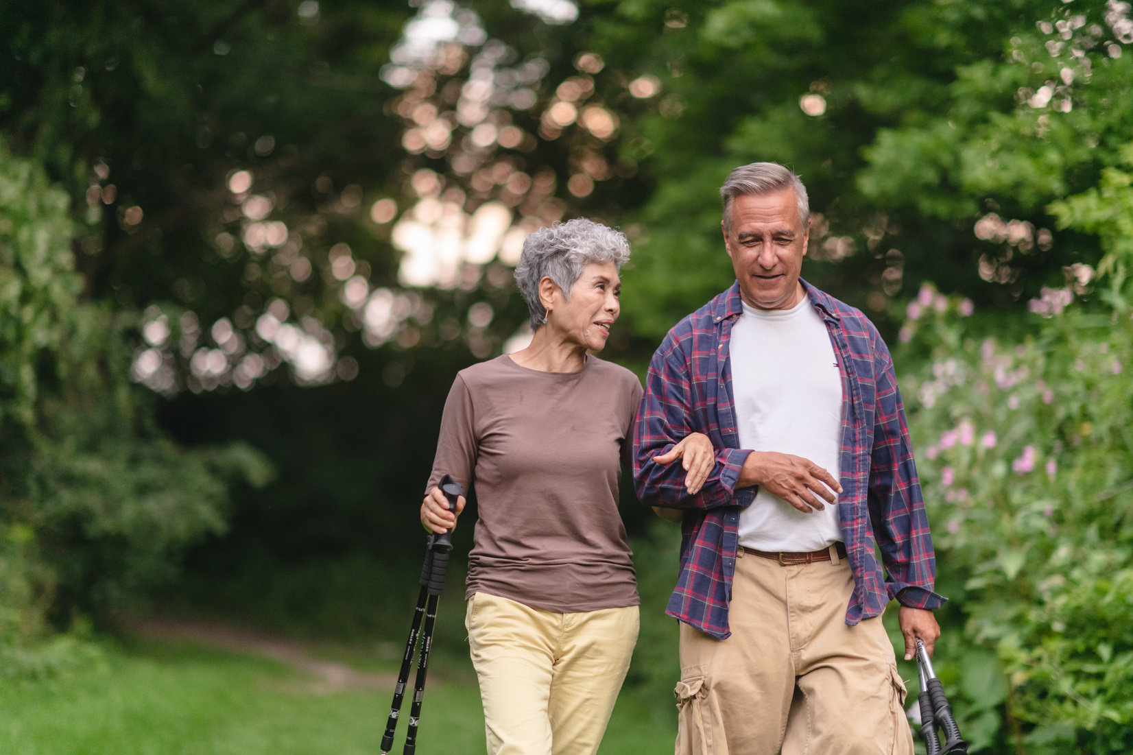 Retired couple hiking in forest
